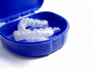 Teeth whitening trays in a blue case